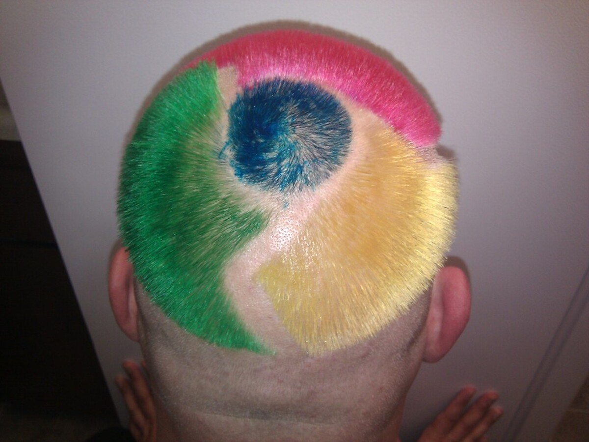 Back of Rob's head showing the Google Chrome logo perfectly rendered in dyed hair: pink arc on top, green on the left, yellow-gold on the right, blue spiral in the center, shaved borders between each section.