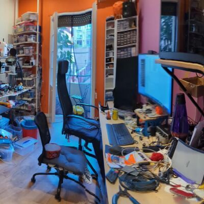 Rob's home workshop packed wall-to-wall with 3D printer, sewing supplies, soldering equipment